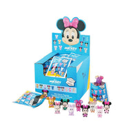 Display box of Disney Minnie Mouse blind bags with open pack and figures in front.
