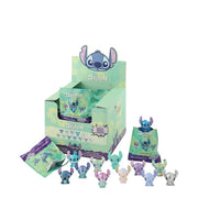 Retail display box of Disney Stitch blind bags with open packets and mini figures lined up below.
