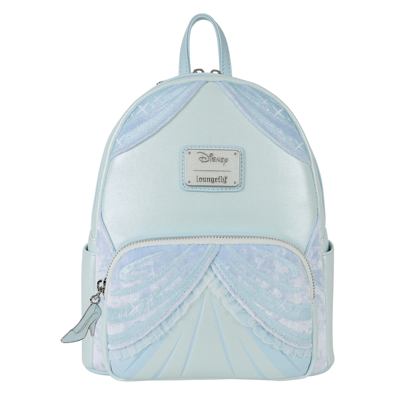 Front of pastel blue Disney Cinderella Loungefly Back Pack bag; velvety drape panels and metal brand badge.	