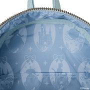 Interior lining of Cinderella Loungefly Back Pack bag with castle, carriage and slipper silhouettes on blue satin.	