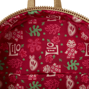 Tropical lining of Loungefly Lilo & Stitch Back Pack bag; red fabric with Lilo sketches, leaves and hibiscus motifs.	