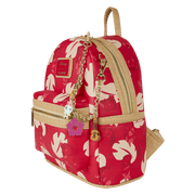 Side view of red Lilo & Stitch Loungefly Back Pack bag with cream leaf print, raffia trim and dangling tropical charms.	