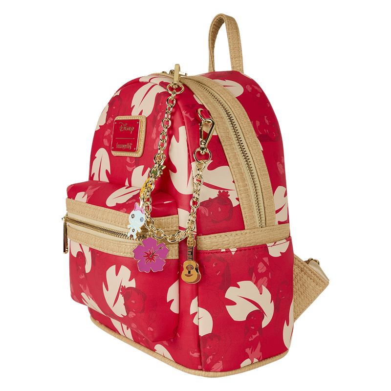 Side view of red Lilo & Stitch Loungefly Back Pack bag with cream leaf print, raffia trim and dangling tropical charms.	