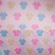 Interior lining of Minnie Loungefly Back Pack bag with pastel pink, blue and yellow Minnie icons.	