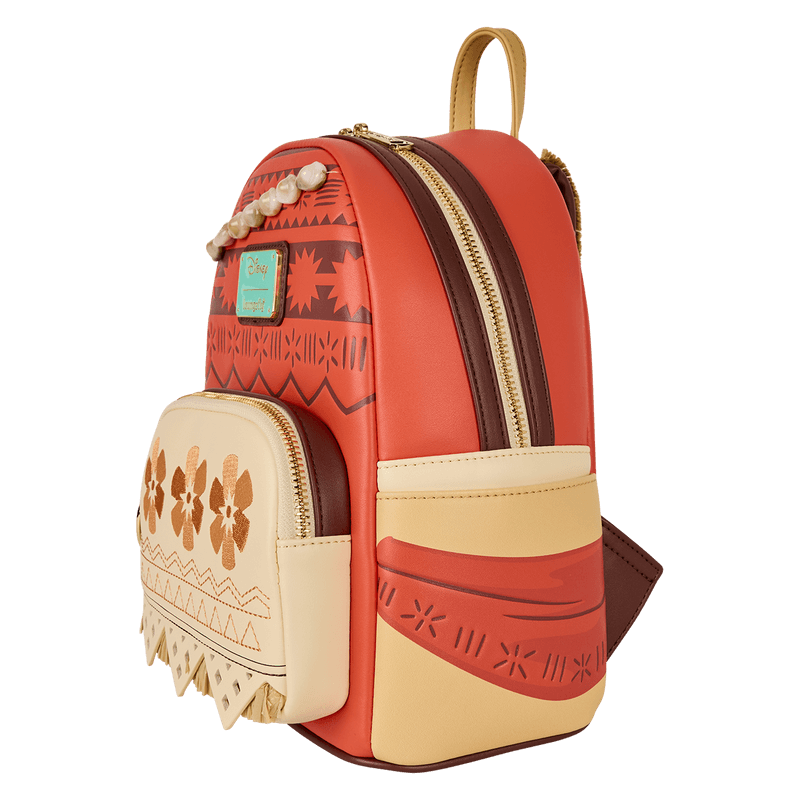 Side view of Moana Loungefly Back Pack bag showing coral panels, brown zip and tribal sash artwork.	