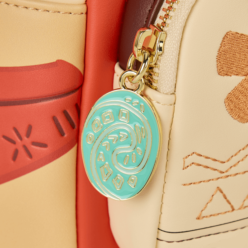 Close‑up of turquoise Heart of Te Fiti enamel zip charm on Moana Loungefly Back Pack bag.	