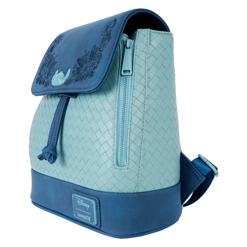 Side view of teal Loungefly Disney Stitch Back Pack bag with woven texture, side zip pocket and navy floral flap.	