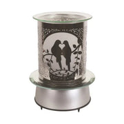 Unlit view of carousel-style dove silhouette wax melt burner on silver base

