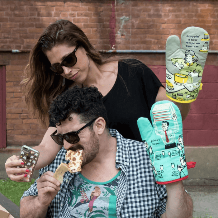 Lifestyle image of Droppin’ A New Recipe On Your Ass oven mitt used outdoors.
