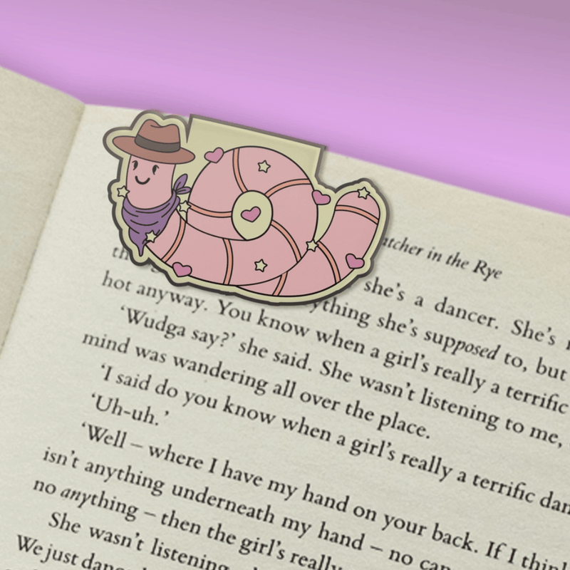 Earl the Worm magnetic bookmark clipped over a book page