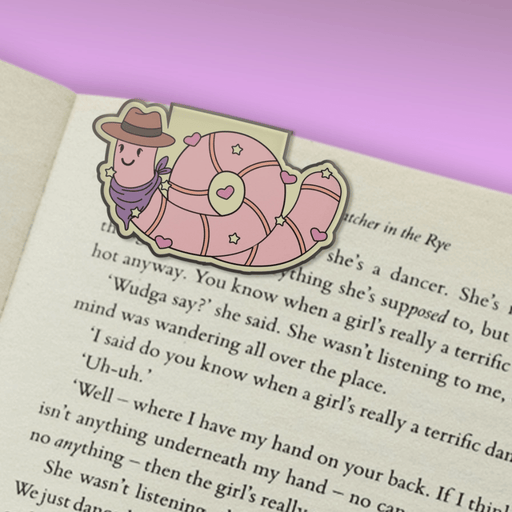 Earl the Worm magnetic bookmark clipped over a book page