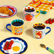 Eleanor Bowmer Breakfast Club mug styled with breakfast food and colourful tableware