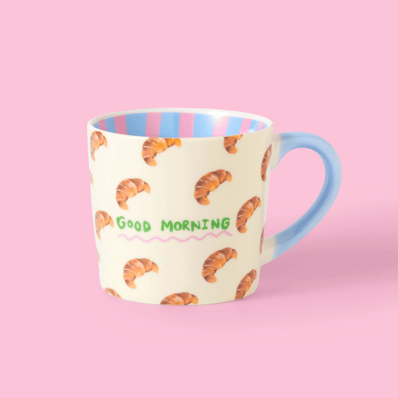 Eleanor Bowmer Good Morning Croissant mug with cream finish and blue handle