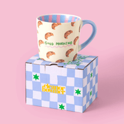 Eleanor Bowmer Good Morning Croissant mug presented with its patterned gift box