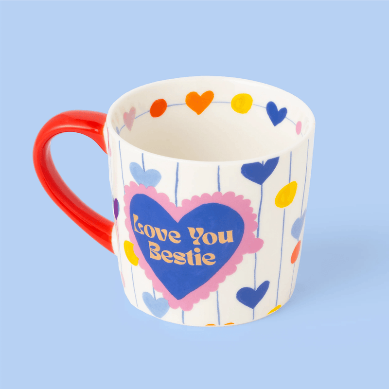 Eleanor Bowmer Love You Bestie mug showing colourful hearts around the inner rim
