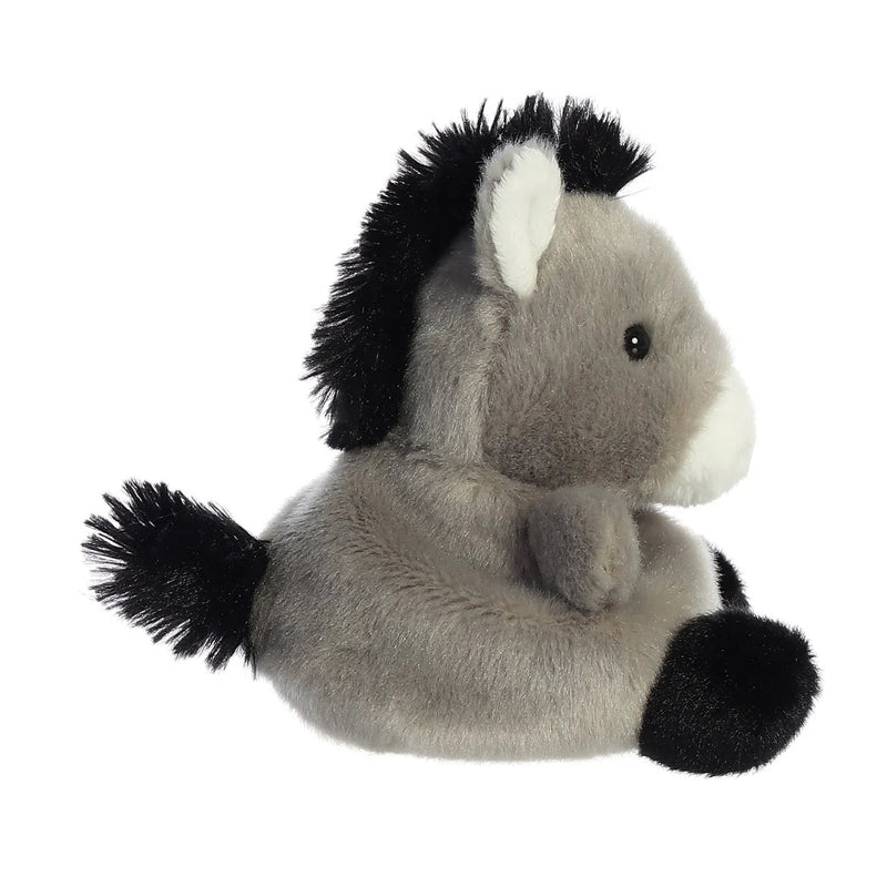 Side profile of Palm Pals Eli Donkey plush showing perky ears and rounded belly
