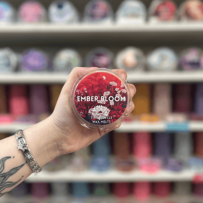 Ember Bloom wax melt pot with red floral label