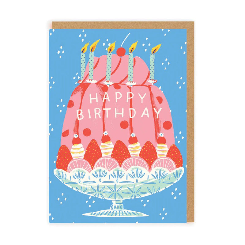 Illustrated pink trifle cake with candles on blue background, Happy Birthday text; A6 greeting card, blank inside with brown kraft envelope by Emily Taylor