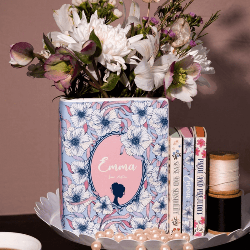 Emma ceramic book vase filled with white and pink blooms on a dressing table
