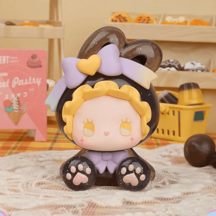 EMMA Bunny Collector Debut Series brown bunny figure with yellow bow and chocolate-inspired styling