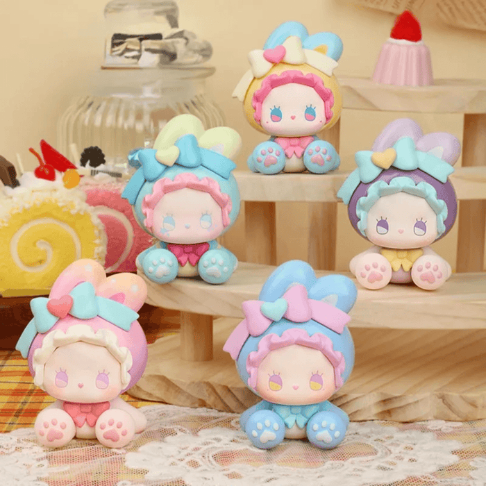 EMMA Bunny Collector Debut Series pastel bunny figures displayed on tiered dessert stands
