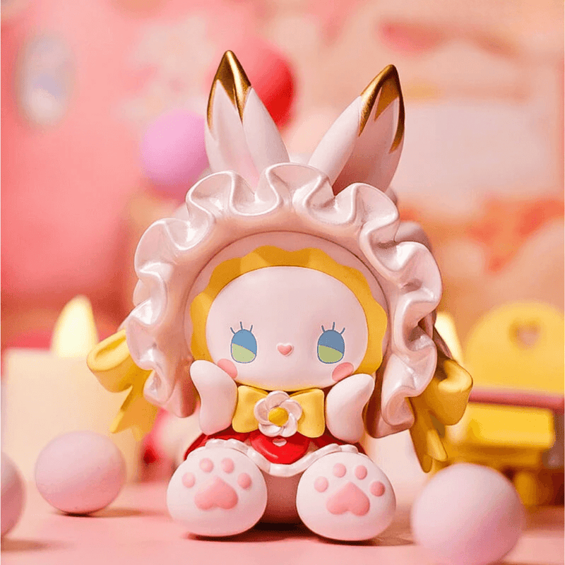“Make a Wish” figure – ribboned bunny with gold candle-crown making a wish
