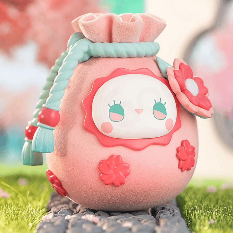 Sakura Lucky Pouch figure – fuzzy pink pouch with teal rope and blossom appliqués, Emma Secret Forest blind box
