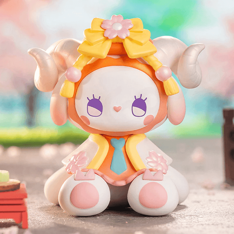 Sakura Onigiri bunny with yellow bow, peach horns and rice-ball palette – Emma Secret Forest blind box
