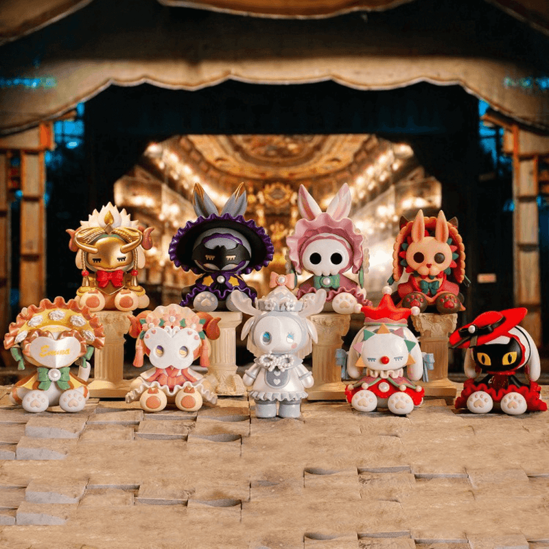 All nine Emma Secret Forest Masked Masquerade figures lined up on a theatre stage, spotlit group photo
