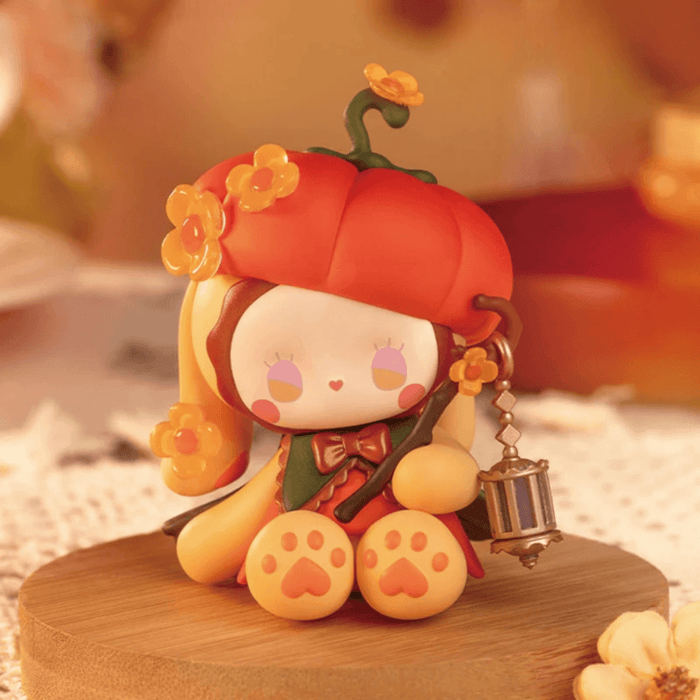 EMMA Secret Forest Perfume Discovery Series Amber figure with pumpkin-inspired hat and lantern accessory