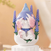 EMMA Secret Forest Perfume Discovery Series Lavender figure sitting in a cracked egg shell with purple flowers