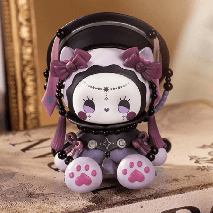 EMMA Secret Forest Perfume Discovery Series Tonka Bean figure in dark purple outfit with bead details
