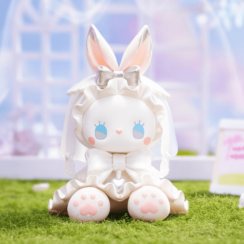 Emma Secret Forest Wedding Series – Rabbit Bride seated in satin dress with tall silver bunny ears
