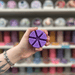 Exotic Bloom purple segmented wax melt held in hand