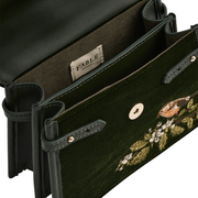 Interior of Fable England Eliza green velvet handbag showing magnetic fastening, compartments and internal slip pocket