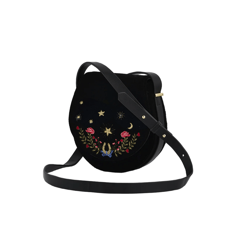 Fable England Kate Celestial black velvet saddle bag with embroidered roses, golden stars and adjustable strap