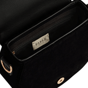 Interior of Fable England black saddle bag showing magnetic fastening, lining and zipped pocket