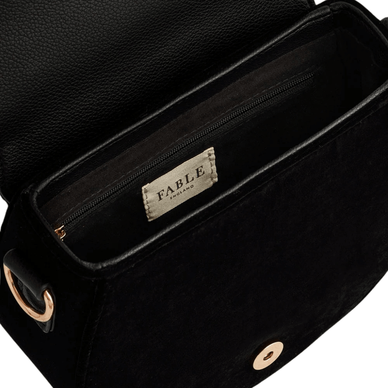 Interior of Fable England black saddle bag showing magnetic fastening, lining and zipped pocket