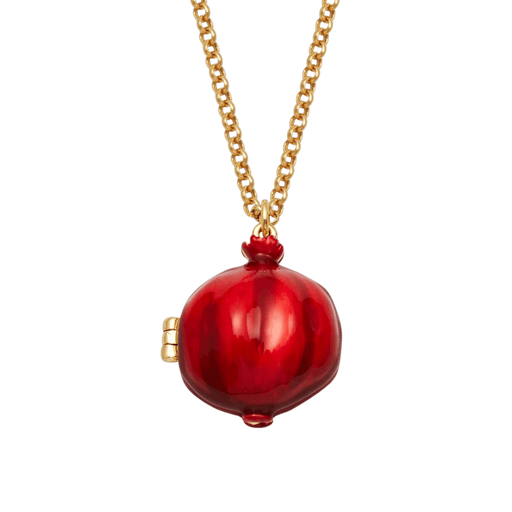 Close-up of red enamel pomegranate locket showing sculpted fruit shape and gold hinged fastening