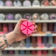 Fairies of the Shadows wax melt segments held in hand with colourful wax melt display in the background