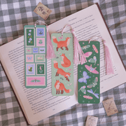 Fairycore Stamps bookmark displayed with fox and butterfly bookmarks