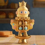 Farmer Bob Feeling You “Happy” figure with golden crown opening coat to reveal pastel cupcakes.
