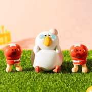 Punchline Fatgoose sitting between two red boxing characters in an outdoor lifestyle scene