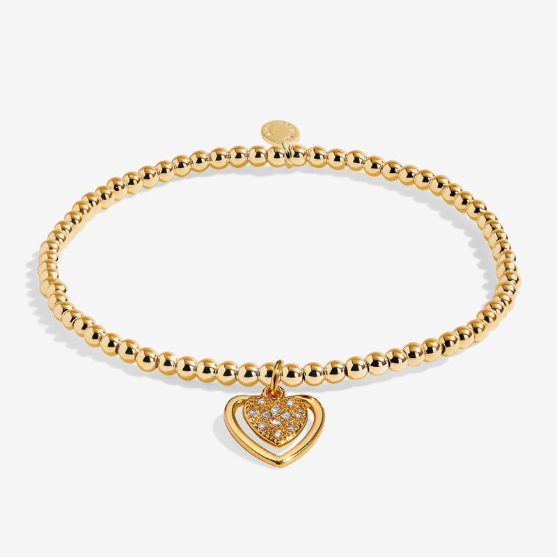 Full view of Joma Jewellery A Little First My Mum Forever My Friend Bracelet, gold-plated beaded stretch Bracelet with sparkly heart charm.