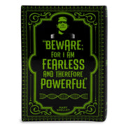 Back of Frankenstein book vase with the line Beware; for I am fearless and therefore powerful in green type.