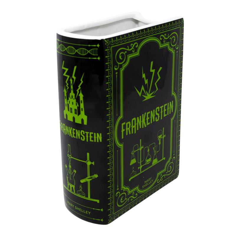 Front cover view of Frankenstein ceramic book vase in black with neon green lab motif and wide top opening.