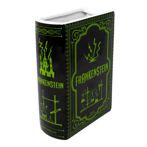 Front cover view of Frankenstein ceramic book vase in black with neon green lab motif and wide top opening.