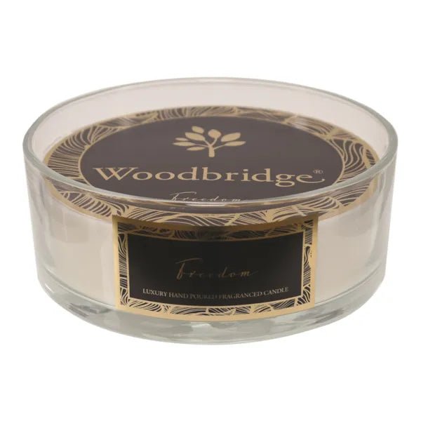 Freedom 5 wick candle in clear glass jar with elegant black and gold label

