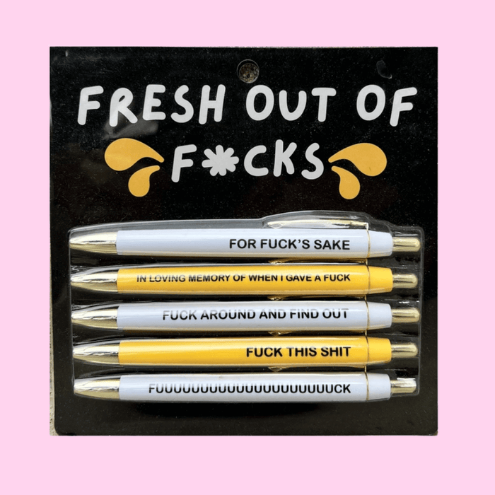Fresh Out Of F*cks pen set on black backing card, 5 black-ink ballpoints in white and yellow with bold, sweary phrases for funny stationery gifts.