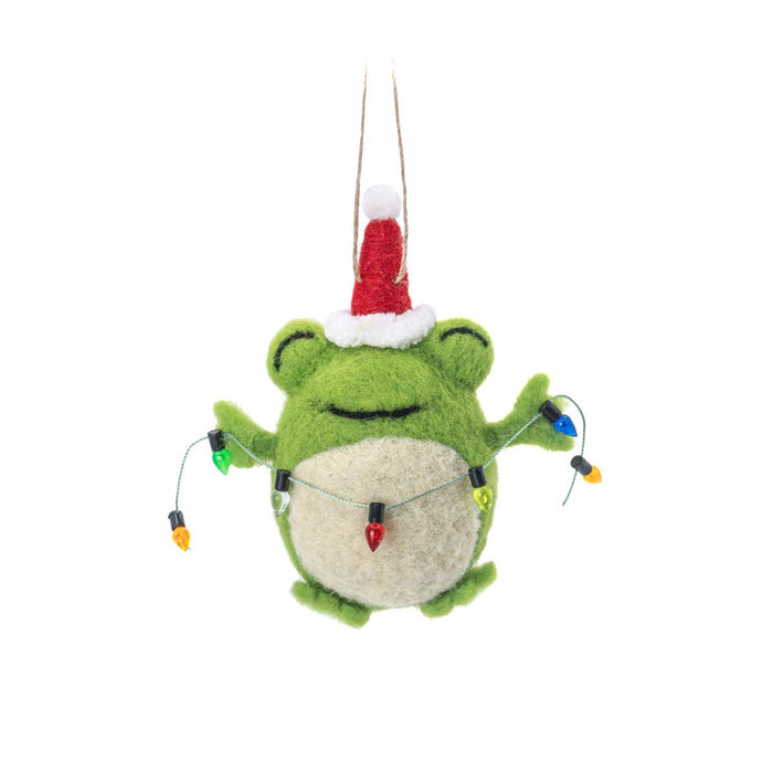 Felt green frog in Santa hat tangled in colourful fairy lights, hanging Christmas tree decoration.